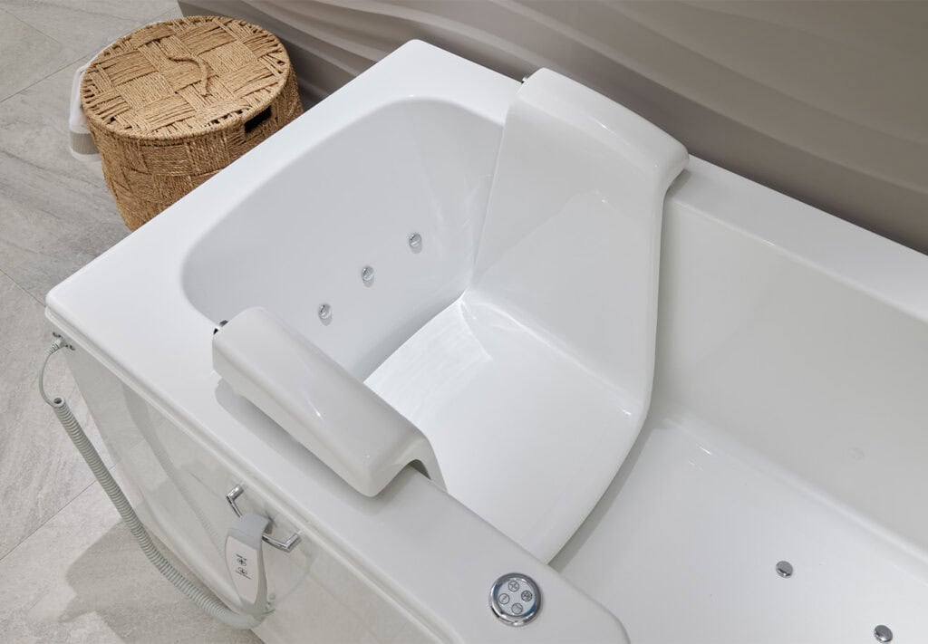 Walk-in bath Roma (Louisiana - access baths) zoomed in half view bath raised down seat in neutral coloured theme bathroom.