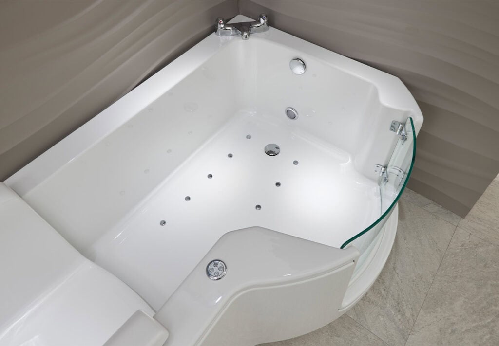 Walk-in bath Roma (Louisiana - access baths) zoomed in aerial view of bath. In neutral coloured theme bathroom.