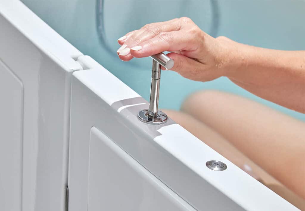 Hand from person bathing pulling up the metal leaver