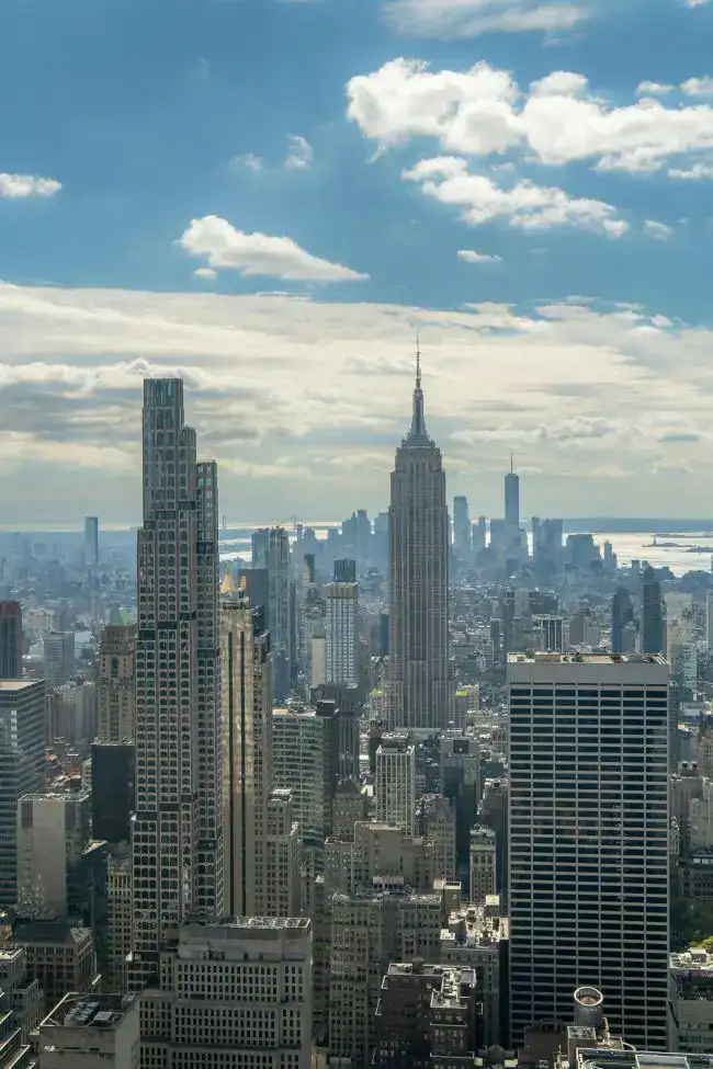 Iconic New York City skyline with Empire State Building and surrounding skyscrapers.