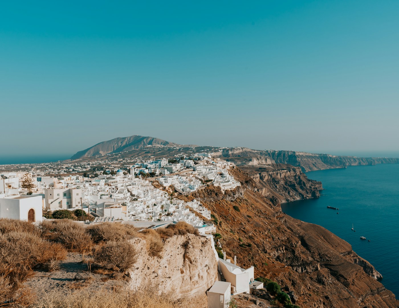 Santorini whitewashed village on the cliff coast - Greece Golden Visa EUR 800,000 Zone A property route 2026