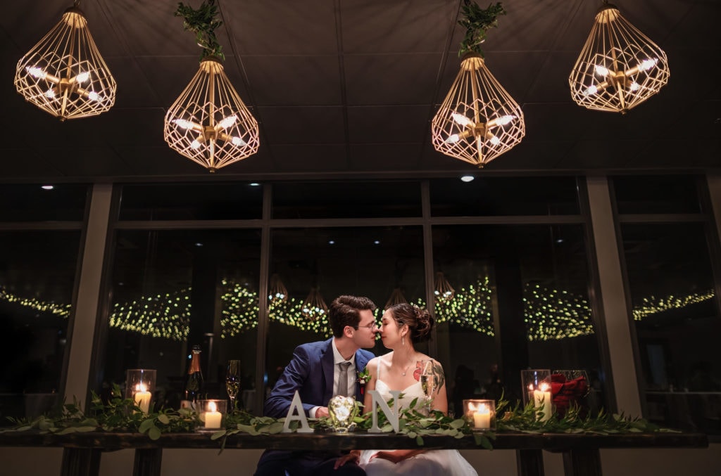 Wedding photographer takes pictures of the couple
