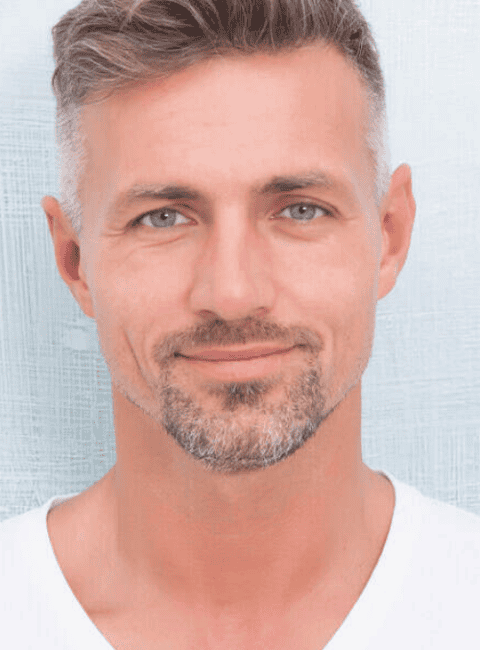 Close-up of a man with well-defined eyebrows after micropigmentation treatment.