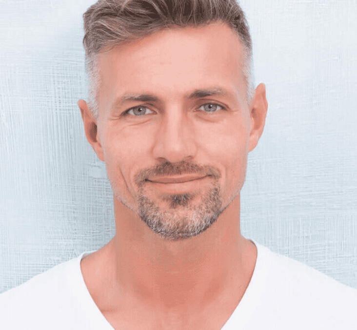 Close-up of a man with well-defined eyebrows after micropigmentation treatment.