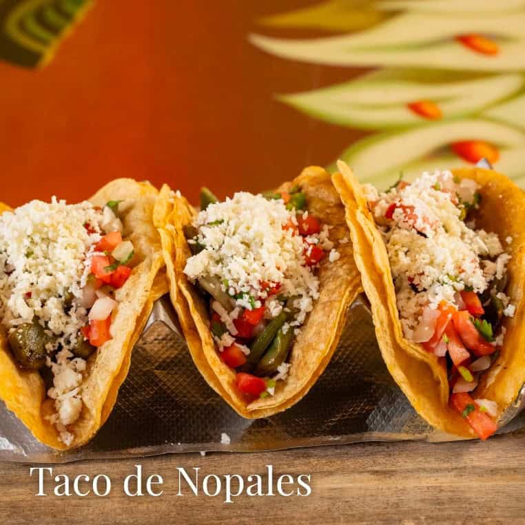 Delicious cactus taco with fresh vegetables and cheese filling.