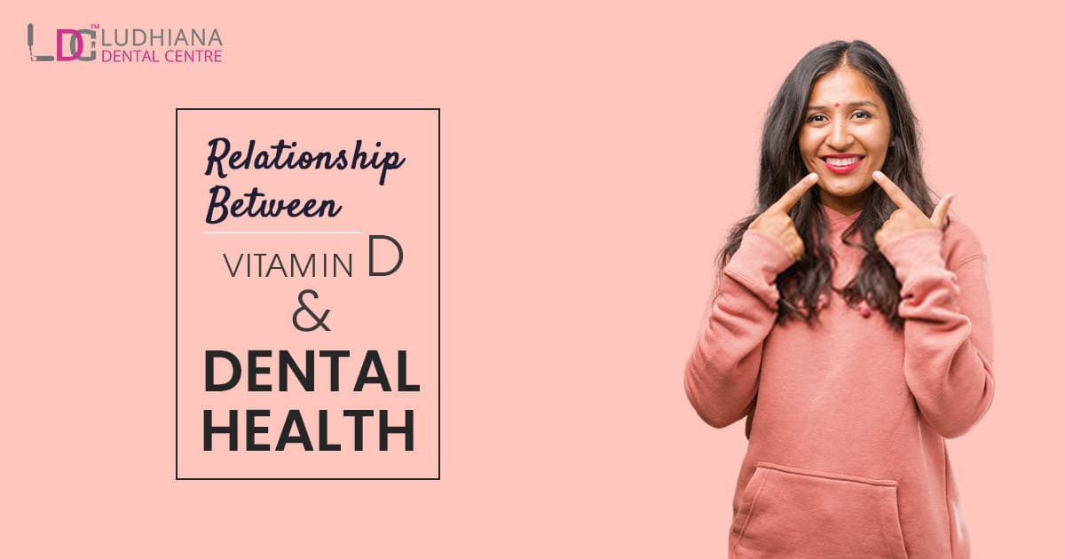 Bright smiling woman pointing to her teeth with pink background for Ludhiana Dental Centre SEO image.