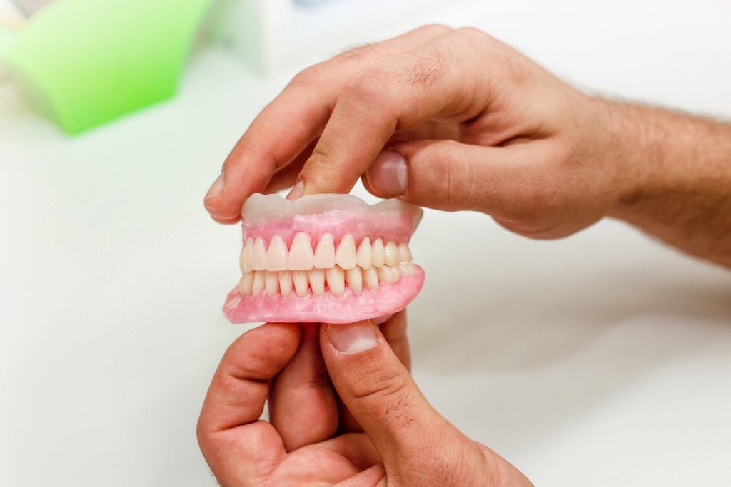 Partial denture model showcasing dental prosthetics for oral health and smile restoration.