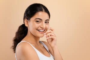 Bright smiling woman showcasing healthy teeth at Ludhiana Dental Centre.