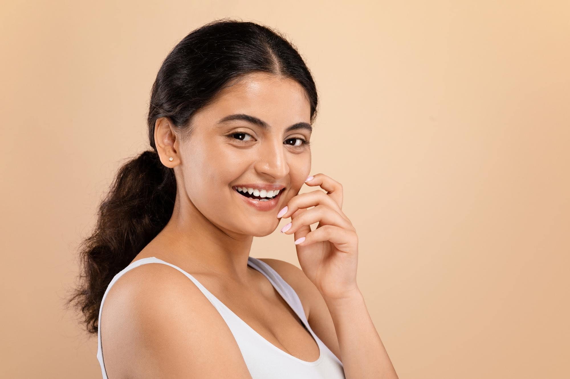 Bright smiling woman showcasing healthy teeth at Ludhiana Dental Centre.