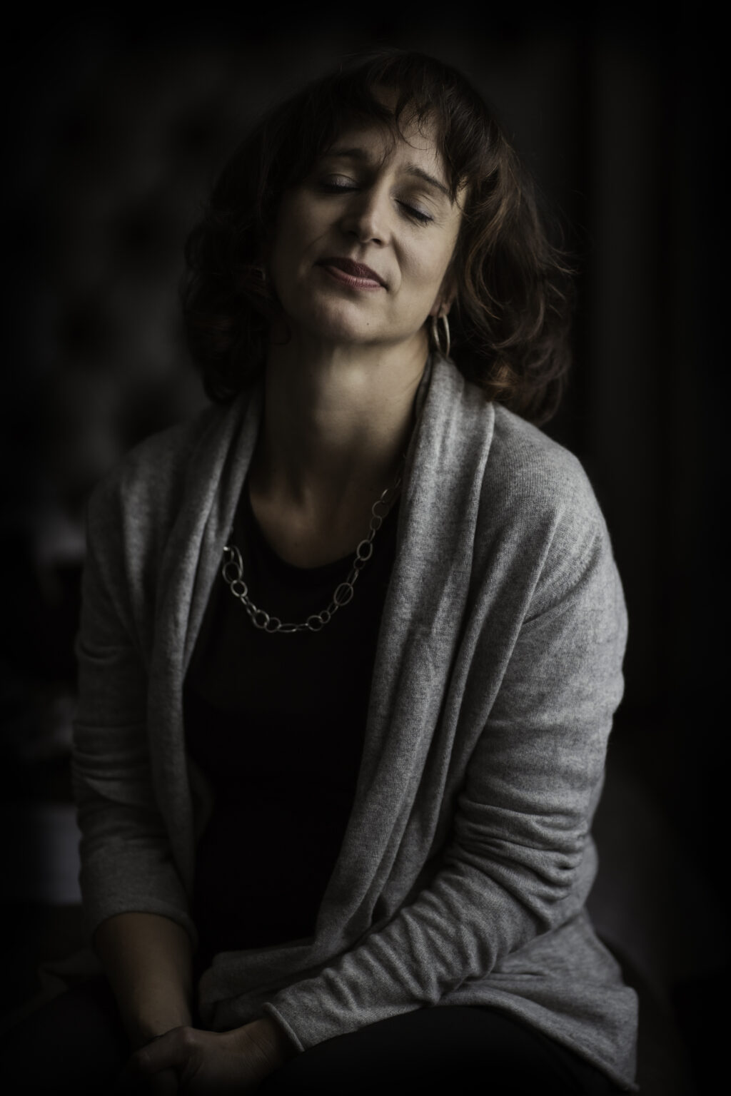 A warm, authentic portrait of a woman, captured by a London brand photographer for coaches.