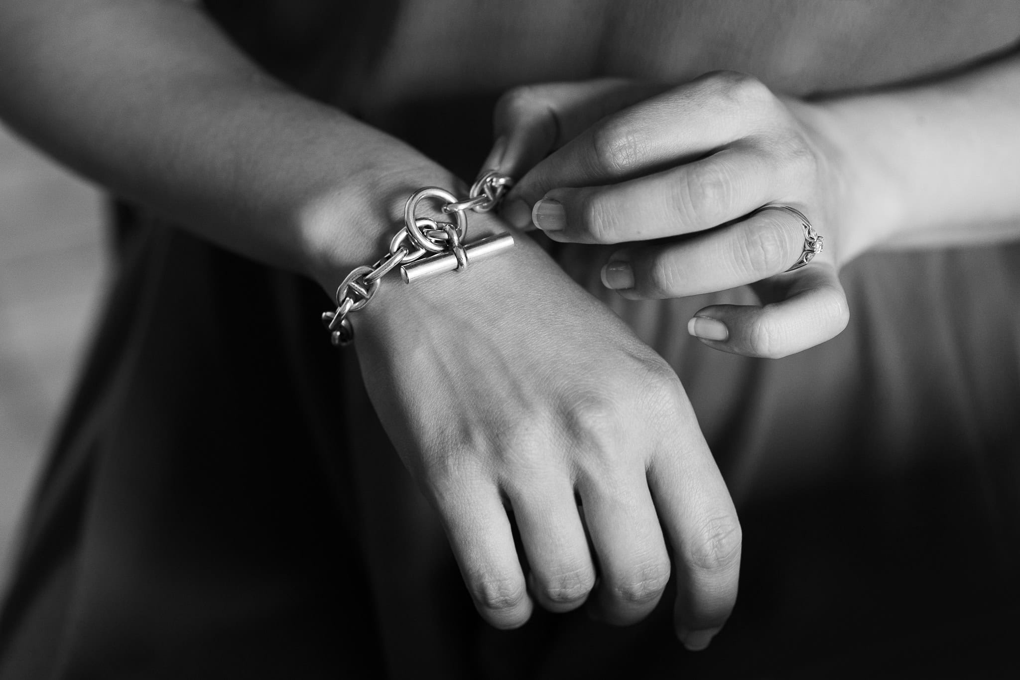 Lorraine Wilkes fastens a chunky silver bracelet on her wrist, her rings catching the light.