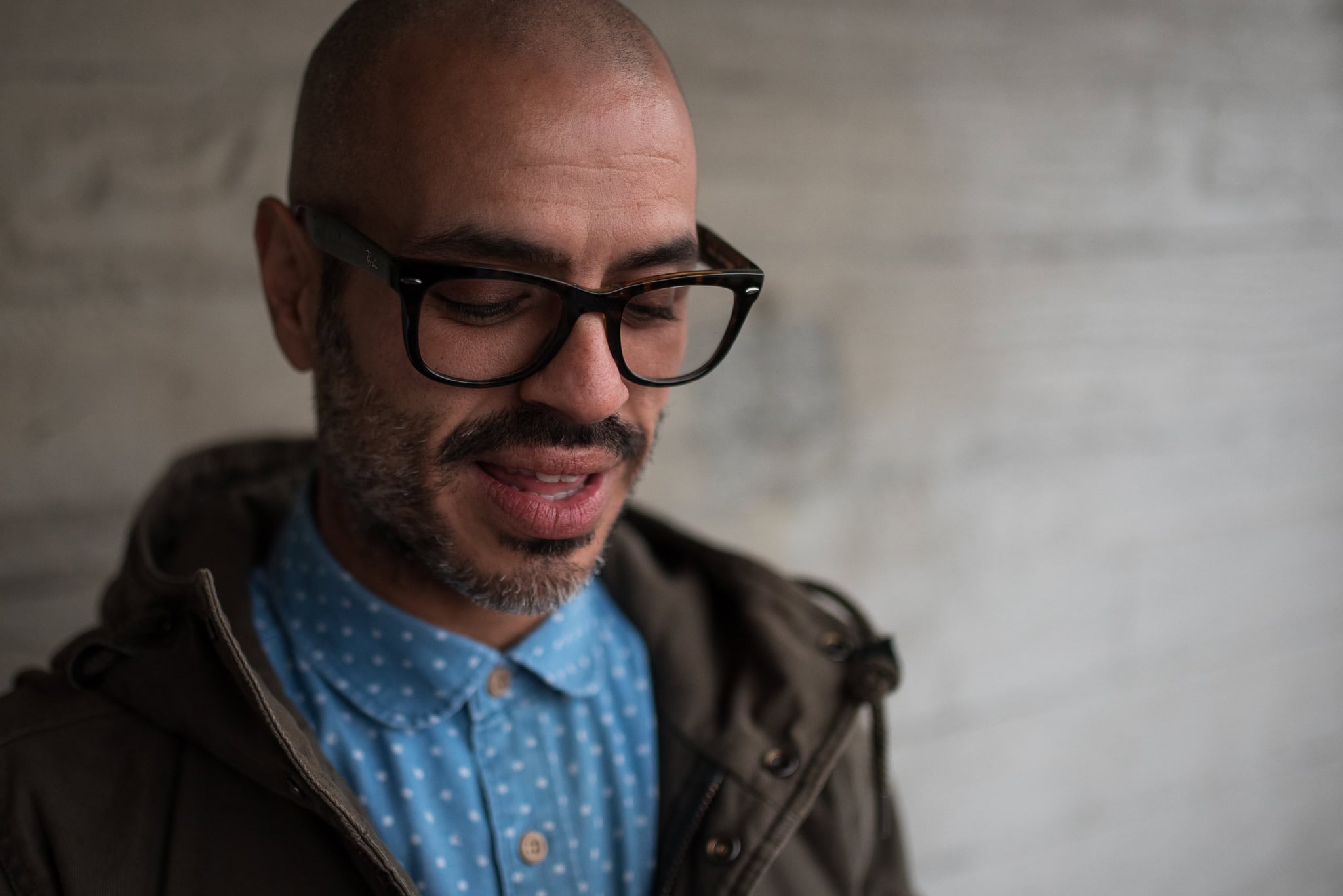 Cahit Ali, a London brand photographer's subject, with a confident, authentic presence, captured in soft, natural light.