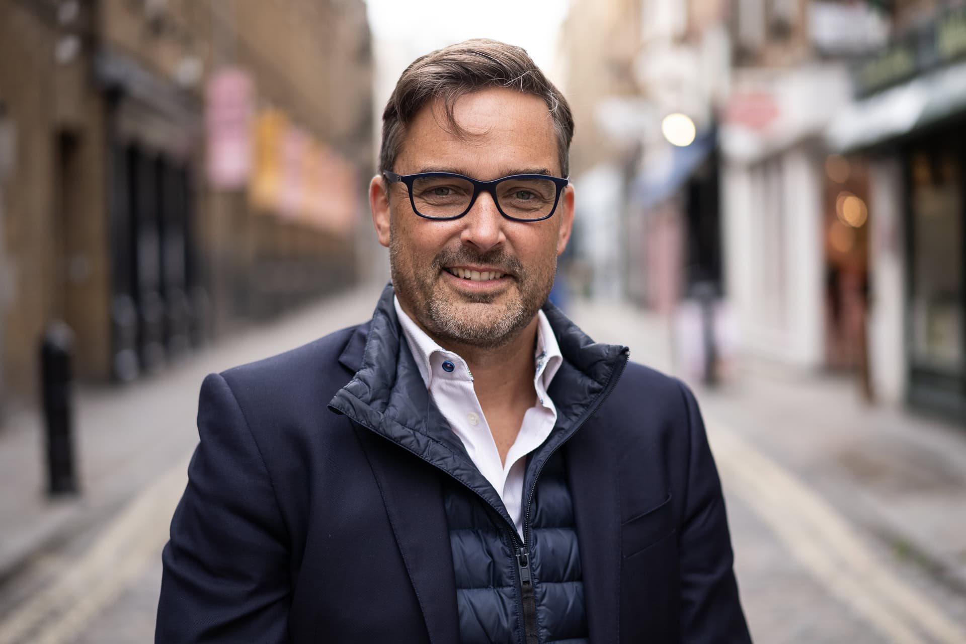 Phil Askew, London brand photographer, captures a confident coach in a London street.