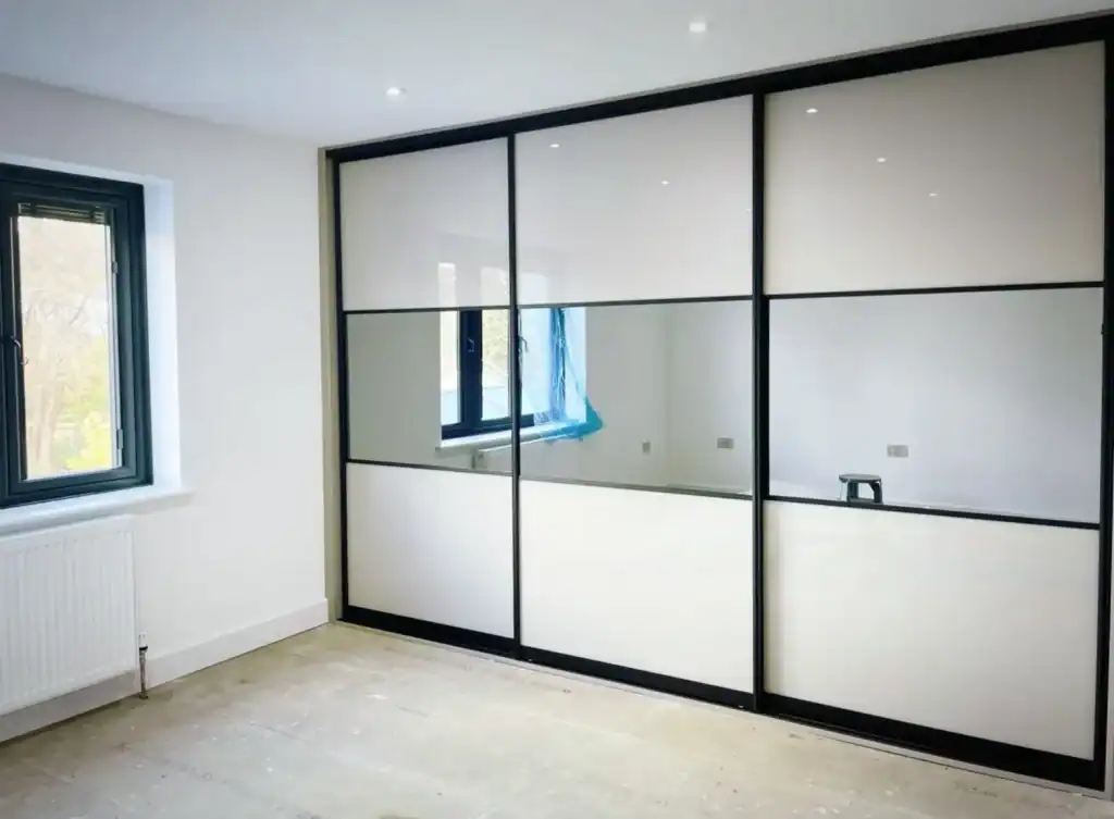 Sliding wardrobe with mirror middle section