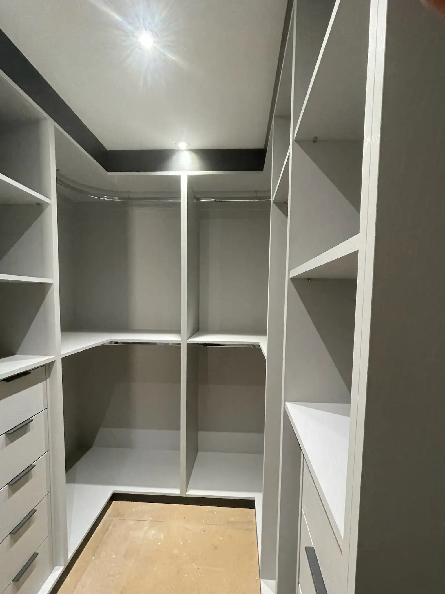 Custom made walk-in wardrobe with tailored storage solutions and modern design.