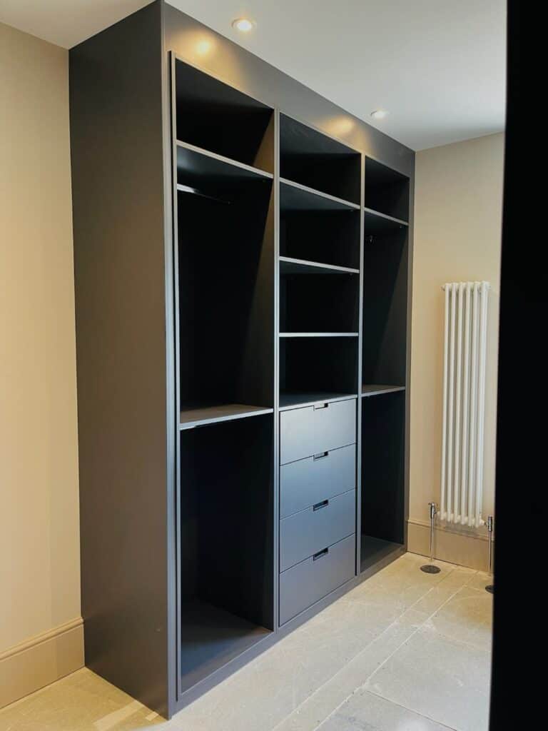 Contemporary custom-built black storage and shelving unit for modern home interiors.
