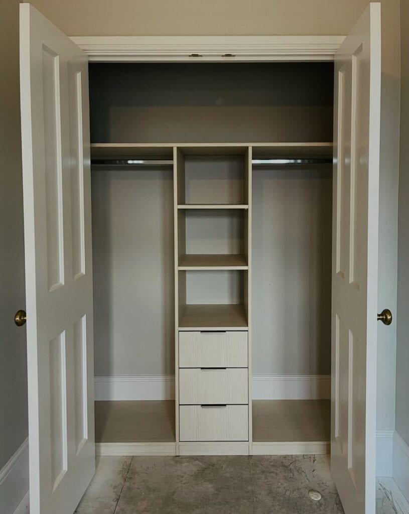 Custom made walk-in wardrobe with tailored shelving and storage solutions, designed by Made 2 Measure Interiors.