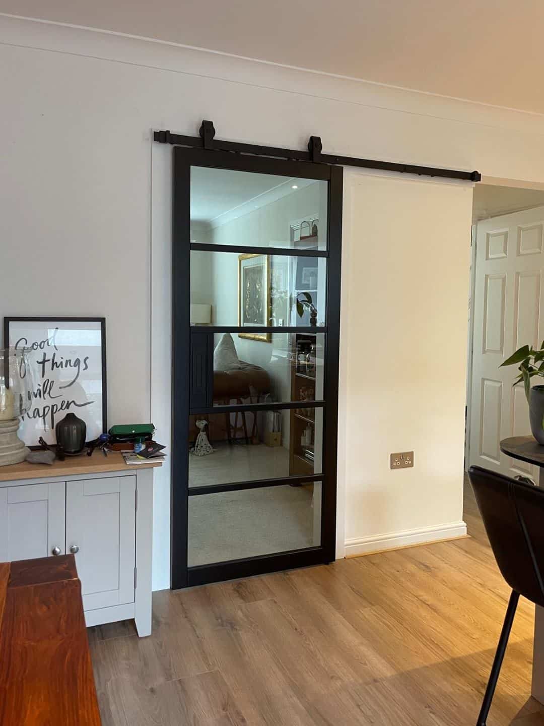 Industrial metal framed glass sliding door, stylish interior room divider, bespoke made to measure interiors, high-quality custom interior design.