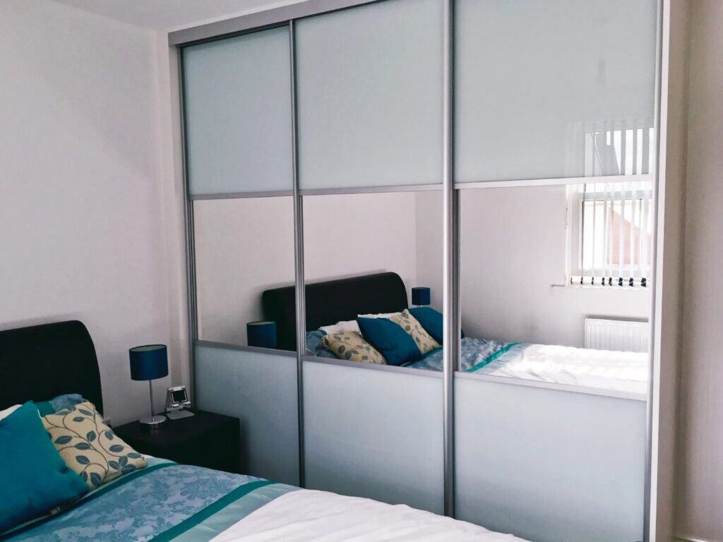Built-in custom sliding wardrobe for modern bedroom storage solutions.