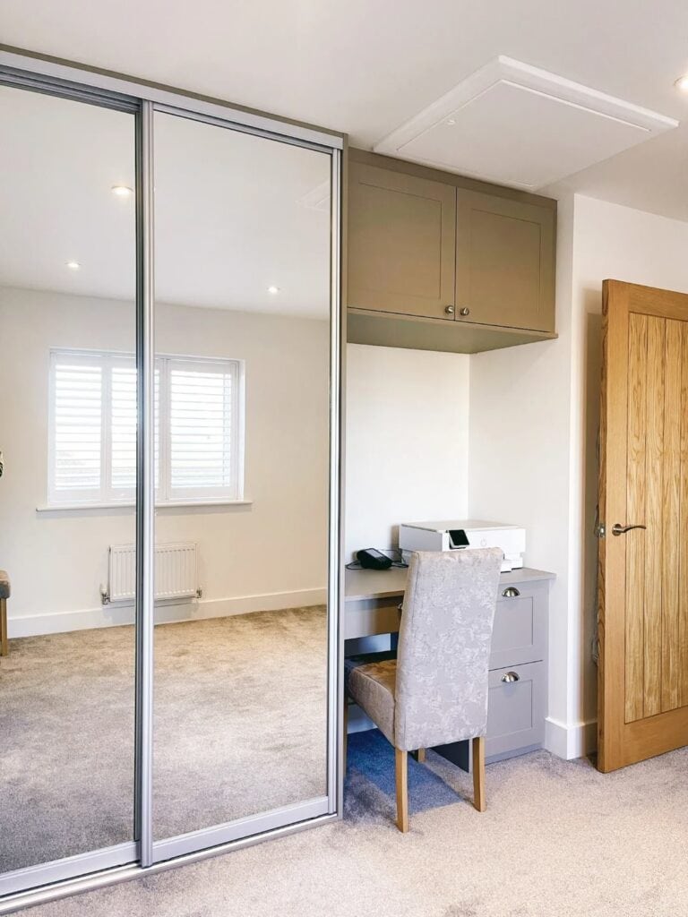 Smooth sliding mirrored wardrobe doors for modern bedroom storage solutions.