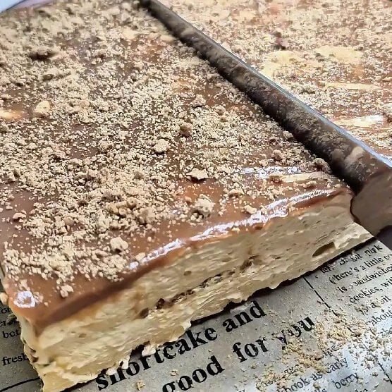 Caramel biscuit cake with crushed biscuit topping