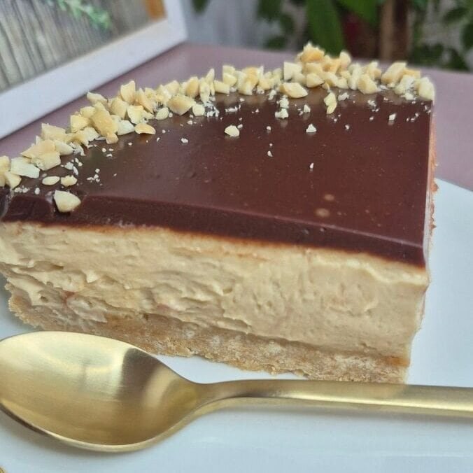 Creamy cheesecake with chocolate topping and crunchy nuts. Perfect for quick, easy, and tasty desserts.