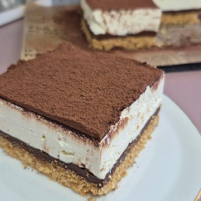 Delicious homemade chocolate tiramisu with layers of mascarpone, cocoa powder, and coffee-soaked ladyfingers. Perfect quick dessert.