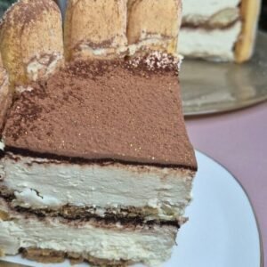 Delicious Italian tiramisu layered dessert with mascarpone, coffee, and cocoa powder. Perfect for special occasions.