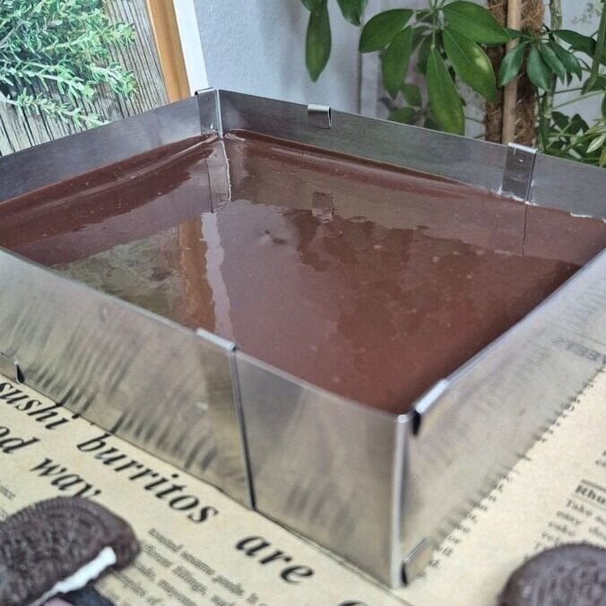 Delicious, glossy homemade chocolate ganache in a stainless steel pan. Perfect for desserts, toppings, and baking.