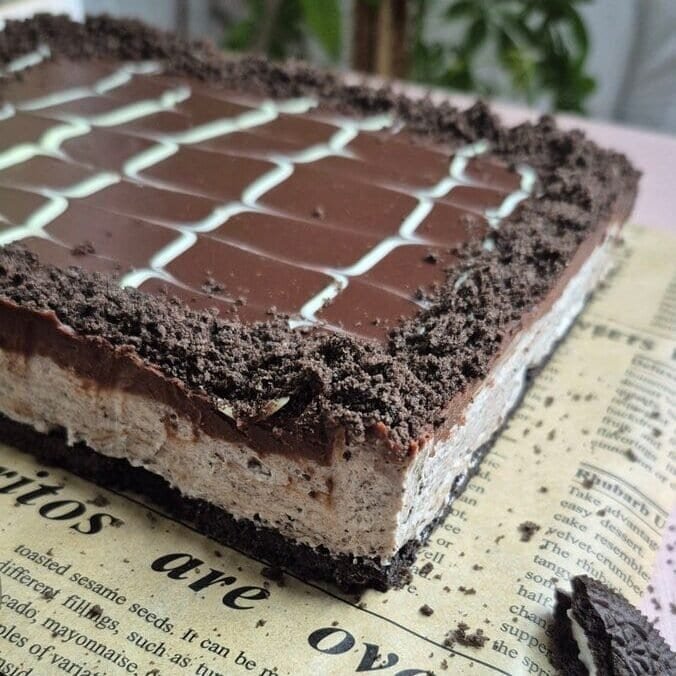 Rich chocolate and cream layered on Oreo cookies for an easy, delicious dessert. Perfect for any celebration or sweet craving.