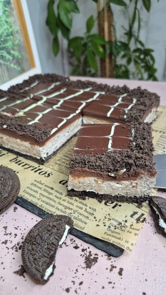 Delicious layered dessert with Oreo crust, creamy filling, and chocolate topping. Perfect easy treat for any occasion.
