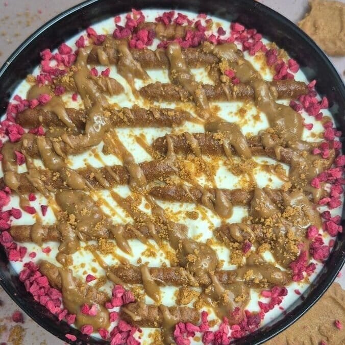 No-bake viral Japanese cheesecake made with Greek yogurt, coffee-dipped Lotus Biscoff biscuits, and melted Biscoff spread in a small dish