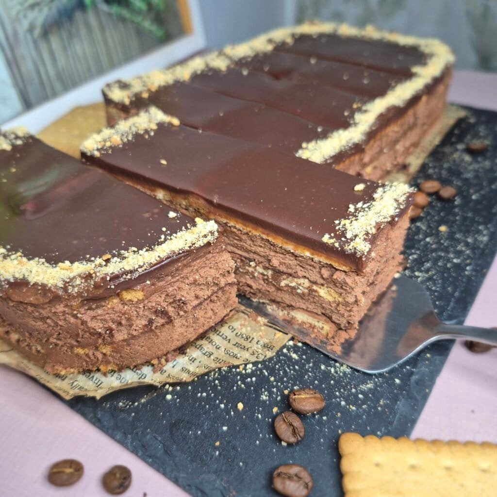 Whole no-bake chocolate biscuit cake with creamy chocolate filling and glossy chocolate topping