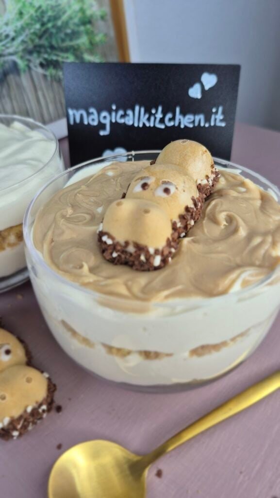 Hippo Cheesecake Cups with biscuit layers, hazelnut cream, and a Happy Hippo on top
