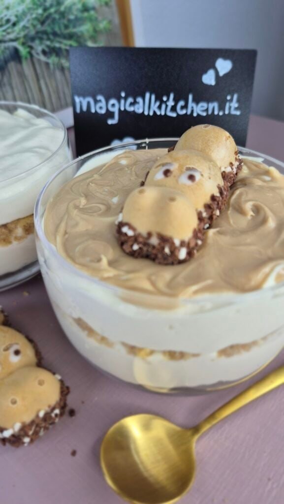 Hippo cheesecake cup with biscuit base, creamy filling, and hazelnut topping