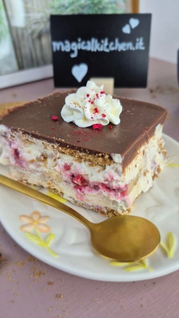 Biscuit cake slice with fruit and chocolate topping