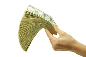 Hand holding out money