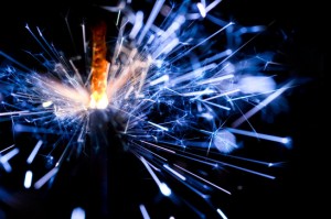Blue sparkler ignites