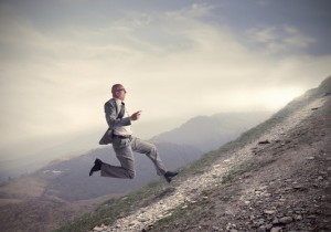uphill climb business man running
