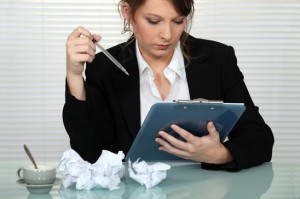 Businesswoman struggling to write presentation