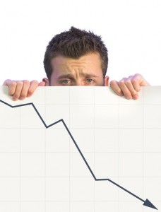 Disappointed business man shows business going broke