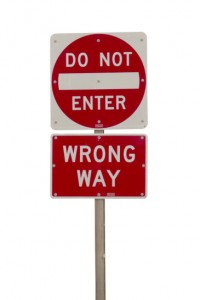 Wrong way red sign isolated on white