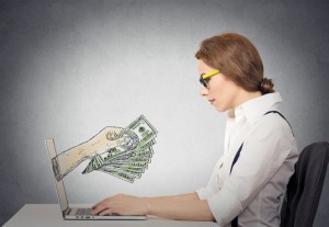 business woman making money working on line on computer