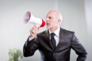 boss giving orders to his employees