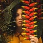 Woman Wearing Yellow Button-up Collared Shirt Beside Green Leaf Plant