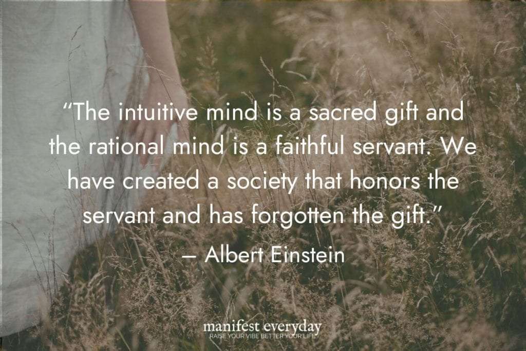 a woman in a summer dress walking in tall grass with quote text that reads the intuitive mind is a sacred gift and the rational mind is a faithful servant. We have created a society that honors the servant and has forgotten the gift. - Albert Einstein manifesteveryday.com