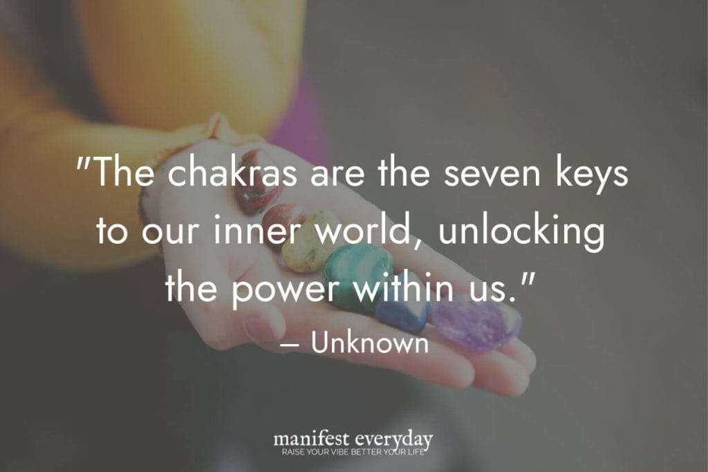 a woman's hand holding crystals of all the chakra colors with quote text that reads the chakras are the seven keys to our inner world, unlocking the power within us. unknown manifesteveryday.com