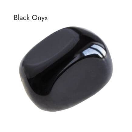 tumbled black onyx stone on white background