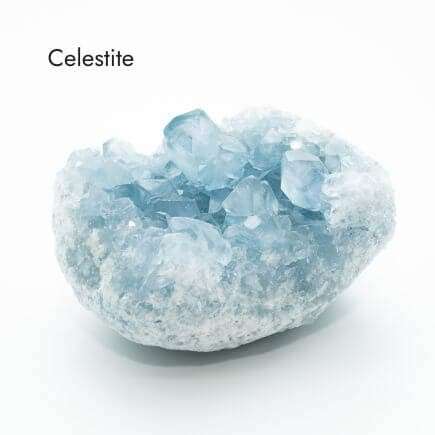 light blue Celestite crystal with white background