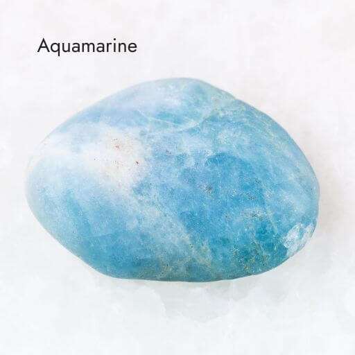 smooth polished aquamarine crystal with white background